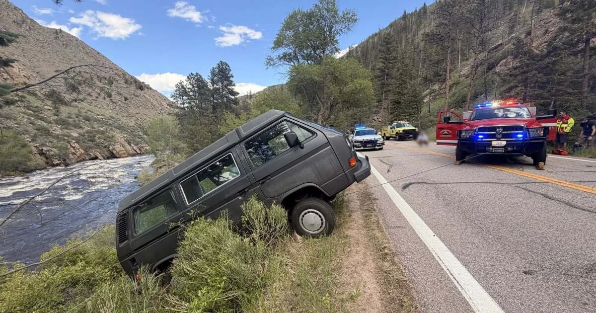 Driver rescued after van backs up a little too far into...