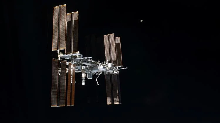 Astronauts briefly take shelter during repair to fix...